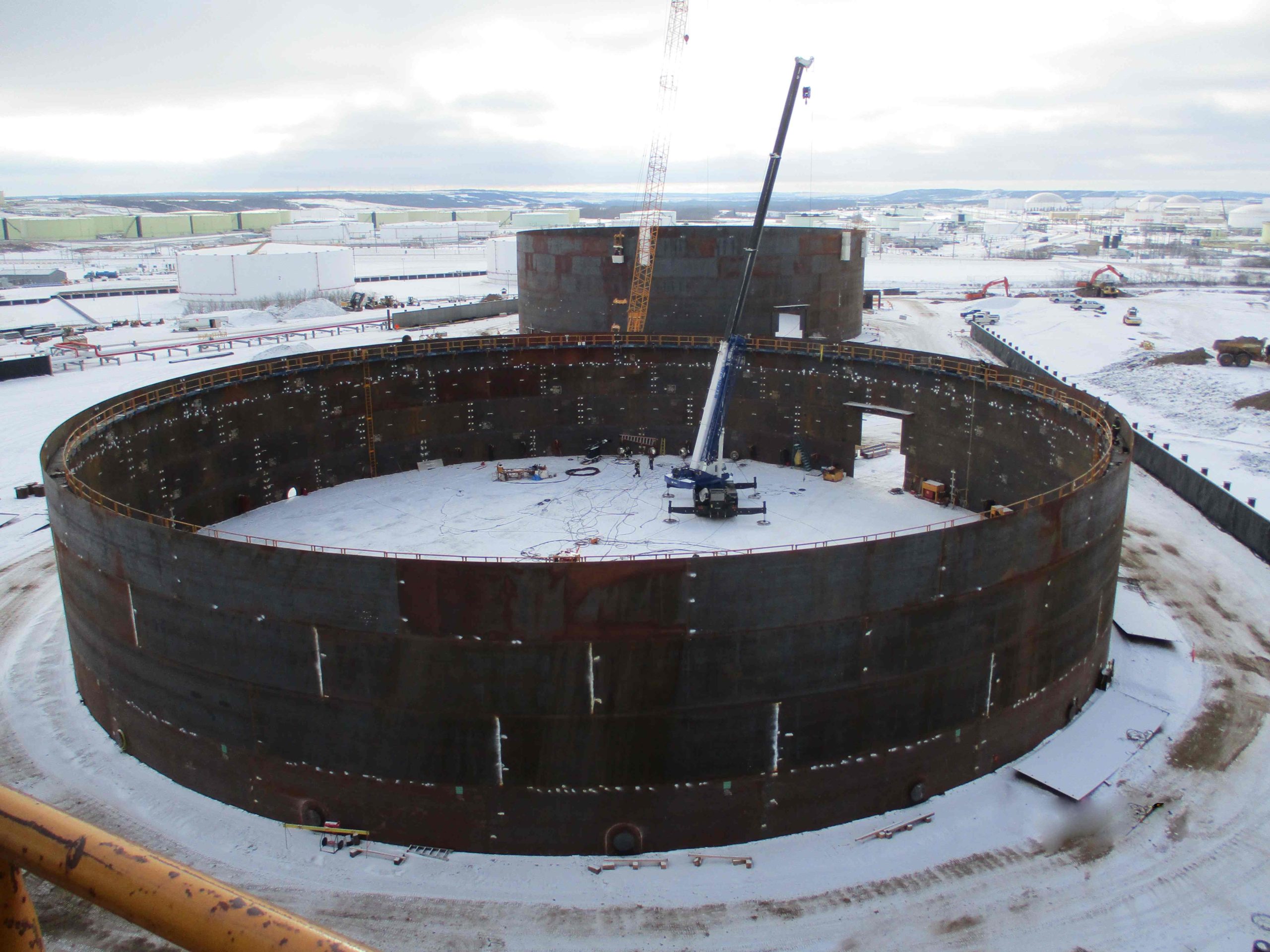 2-ariel-view-constructing-three-211'x80'-high-api-650-column-supported-cone-roof-tanks-by-tiw-steel-platework _2_11